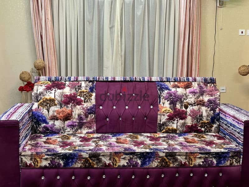 Stylish and comfortable purple sofa with a modern design. High quality 1