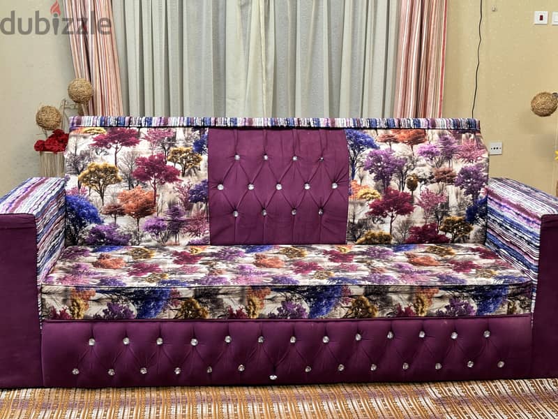 Stylish and comfortable purple sofa with a modern design. High quality 2