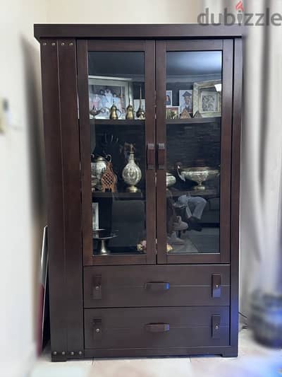 Brown wood frames and decorative items cabinet