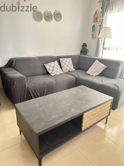 Sofa with cover and table