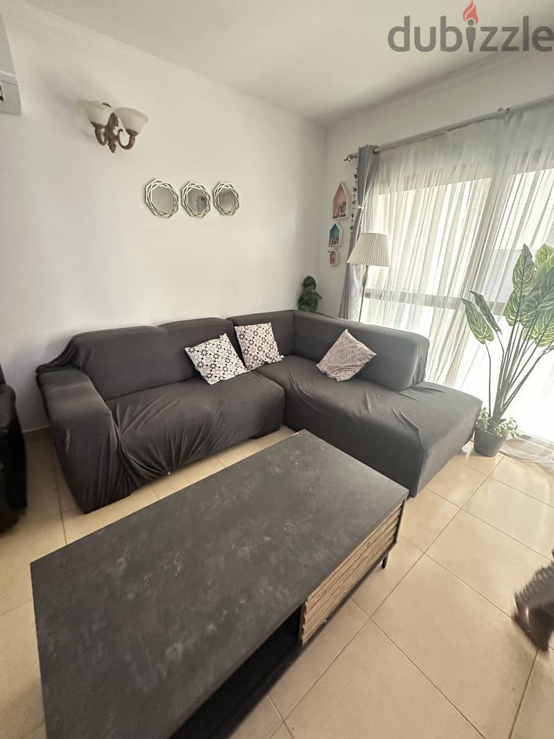 Sofa with cover and table 4