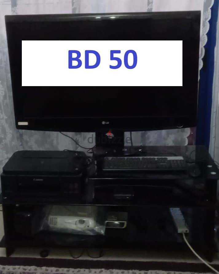 LG TV 42" WITH GLASS STAND 3 SHELVES -BD 50 0