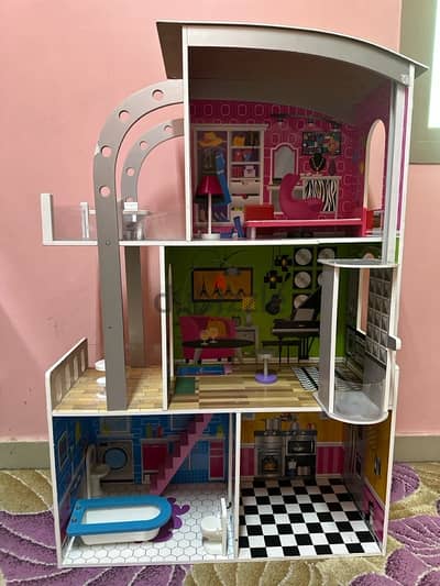 Doll house with wood furniture