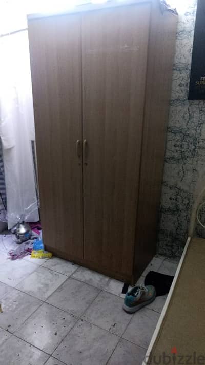 cupboard and single bed