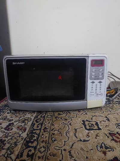 urgent sale Sharp microwave oven