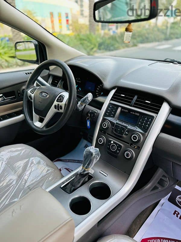 Ford Edge 2013 model. Compact SUV Jeep in very large rear seat with AC 13