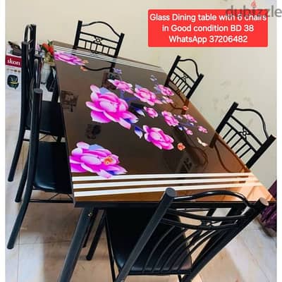 Glass Dining table with 6 chairs and other items for sale