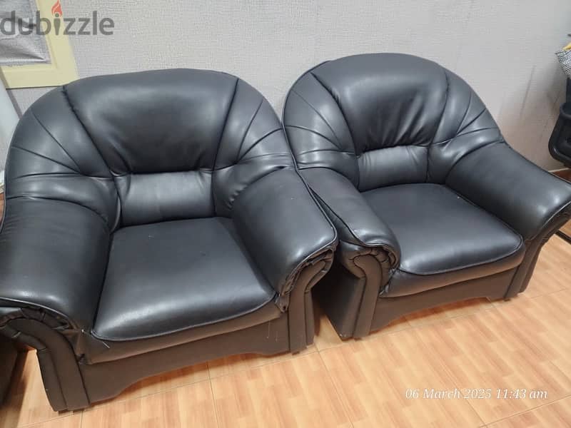 Two comfy leather single-seater sofas 0