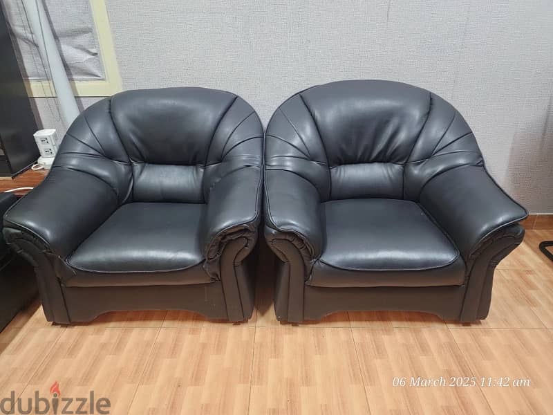 Two comfy leather single-seater sofas 1