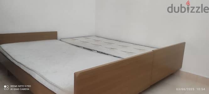 2 single beds with mattresses