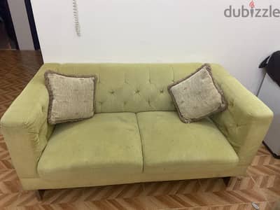 2 seater sofa with two pillows