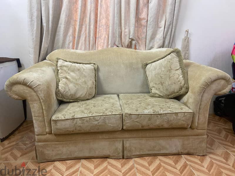 2 seater sofa with two pillows 1