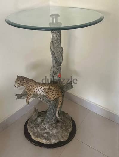 Glass table with jaguar stand scupture