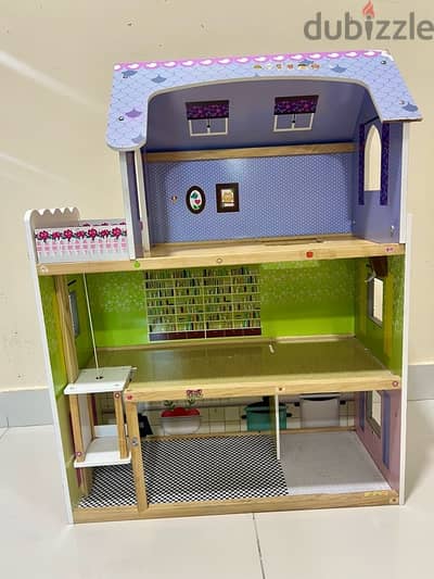 Wooden Doll House with wooden furniture and some plastic toys for free