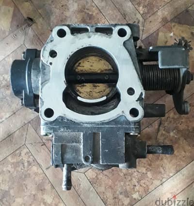 Nissan sunny 2004 throttle body very good condition contact= 39391654