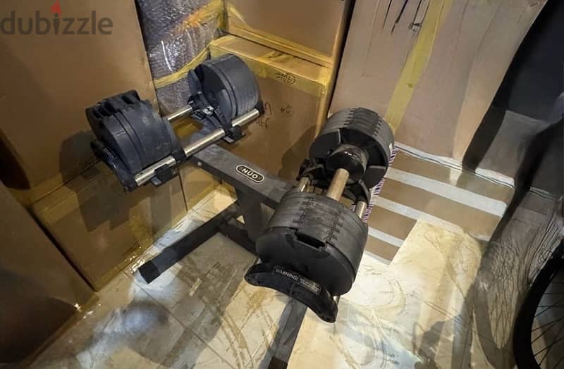 NÜOBELL ADJUSTABLE DUMBBELL with floor stand for sale@ 50. bd 1