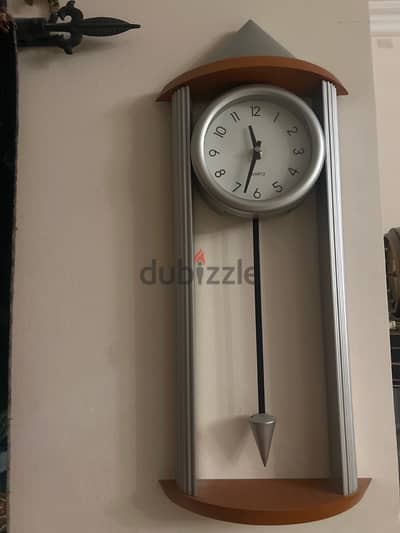 orange and silver wall clock