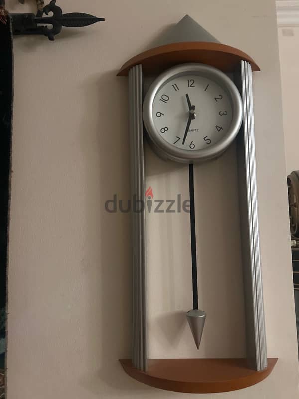 orange and silver wall clock 0