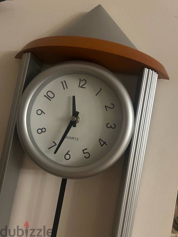 orange and silver wall clock 1