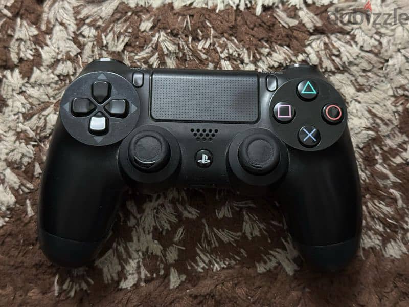 Two genuine Sony PlayStation 4 controllers and 2 games 0