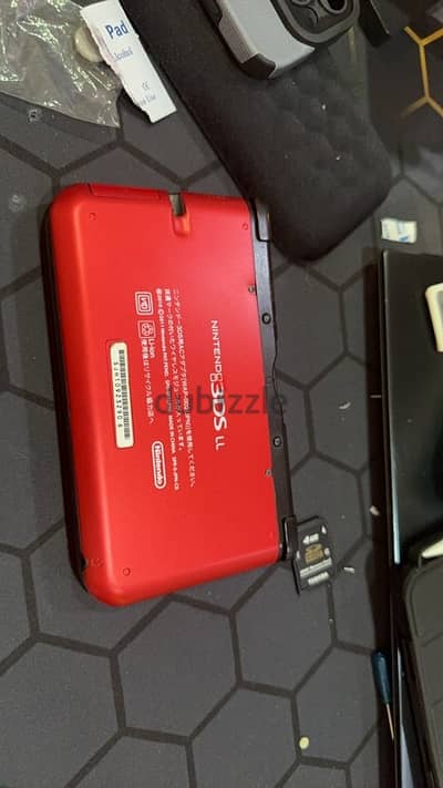 Nintendo 3ds LL Black / Red. 65 bhd. 128gb modded