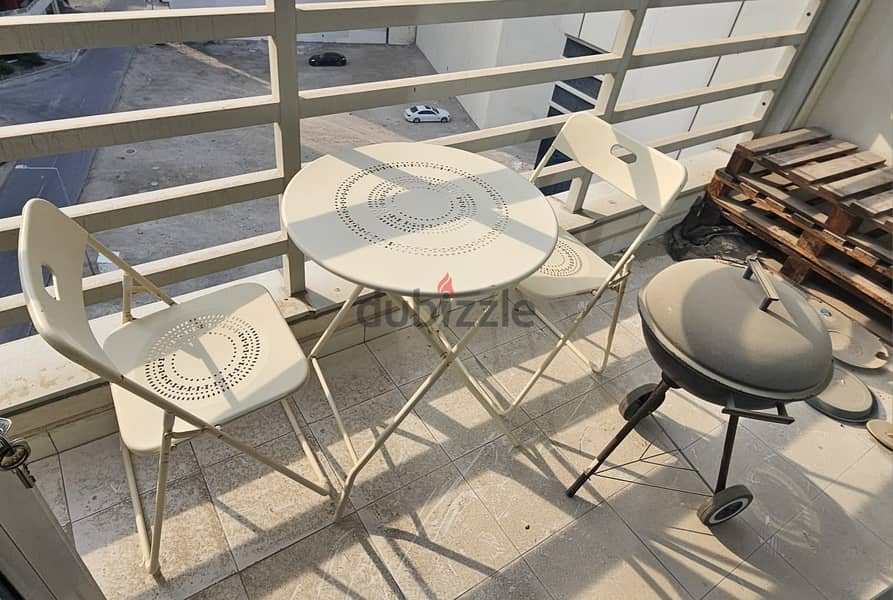 Foldable table and 2 chairs in good condition with small bbq set 2