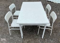 One table and 4 chair for sale 0