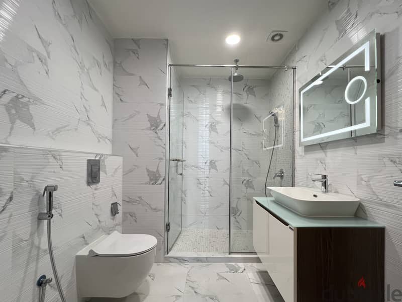 Furnished 1BR Apartment Close to Bahrain Mall | Balcony | EWA Included 9