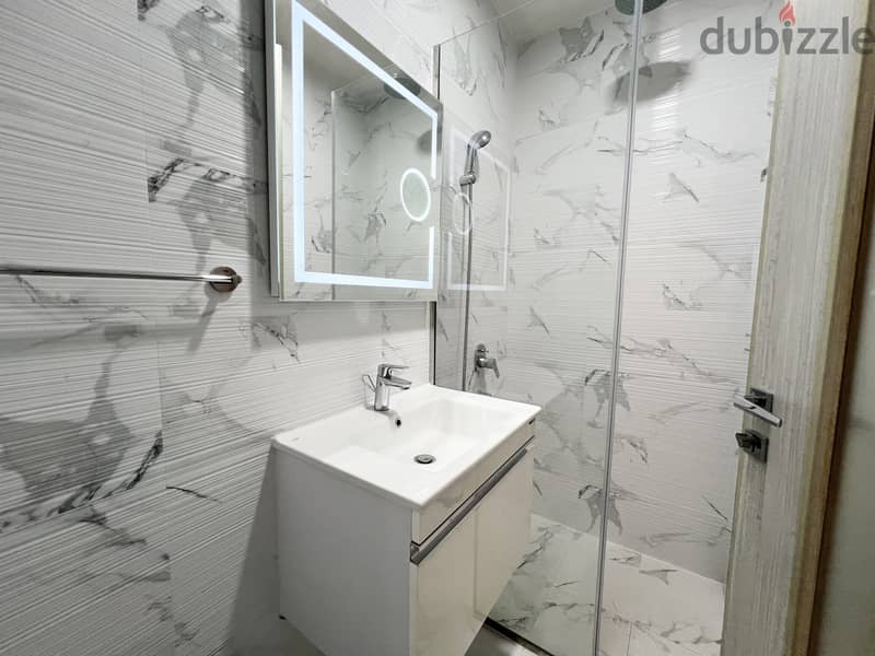 Furnished 1BR Apartment Close to Bahrain Mall | Balcony | EWA Included 10