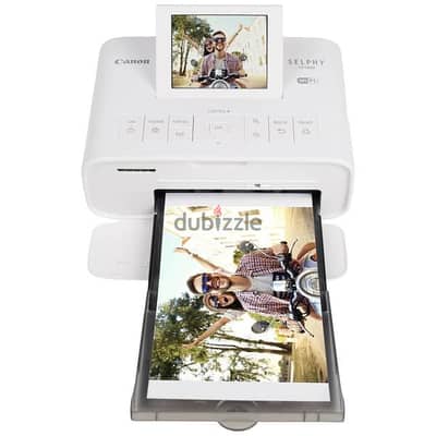 white Canon Selphy full size photo printer
