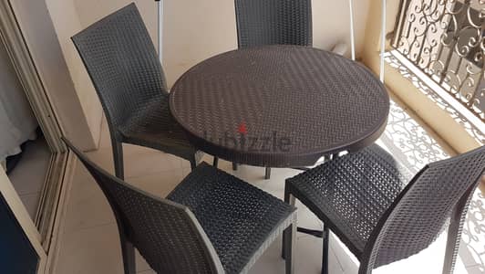 Plastic Chairs 4 Pieces and 1 Table