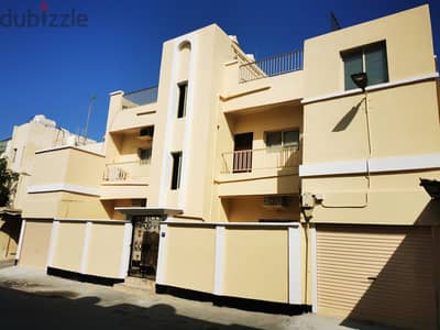 Building for sale in muharraq near Al Kubra Park, behind Al Waha Park