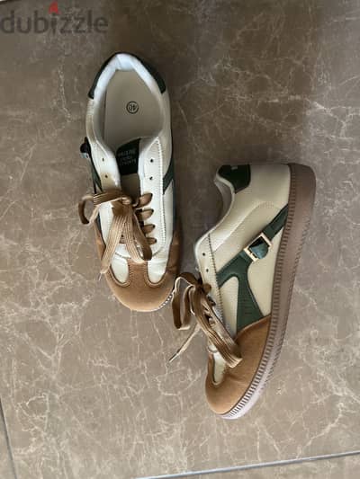 Shows beige-ish brown and green design