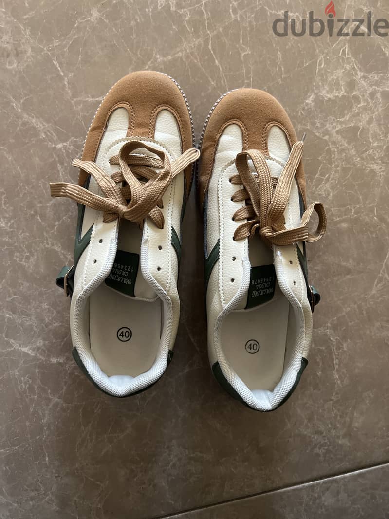 Shows beige-ish brown and green design 1