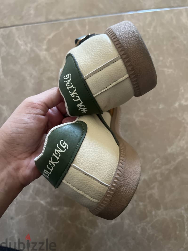 Shows beige-ish brown and green design 3