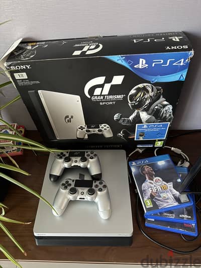 Play station 4 limited edition 1 tb (silver) with 2 controllersgames