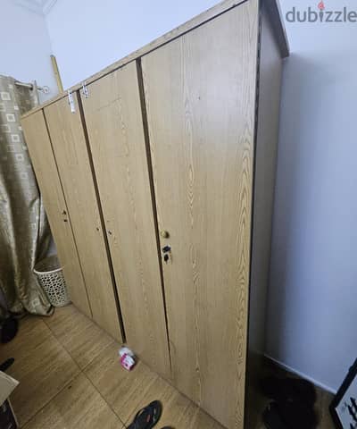 bed and 4 door cupboard