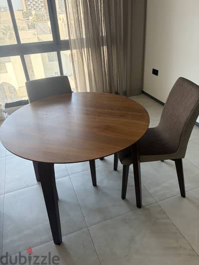 Round Table with two chairs covered with good quality cushion