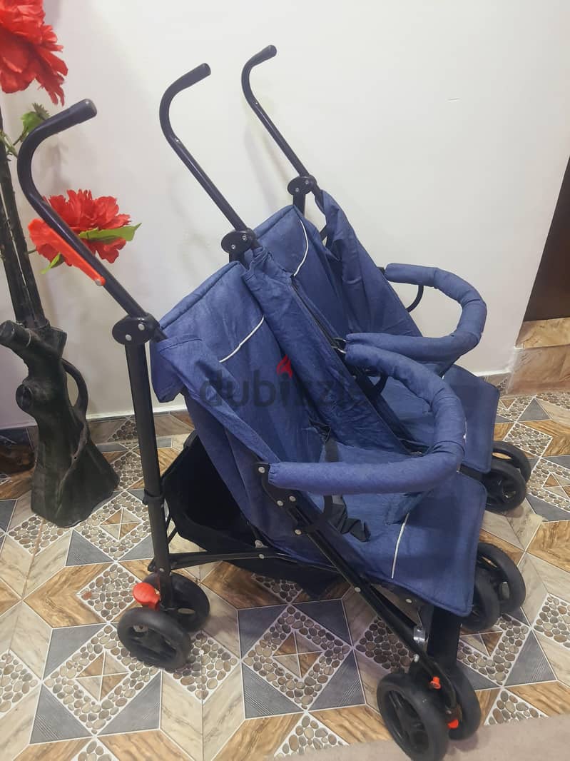 Call (36216143) Baby Double Stroller In Good Condition Easy To fold an 1