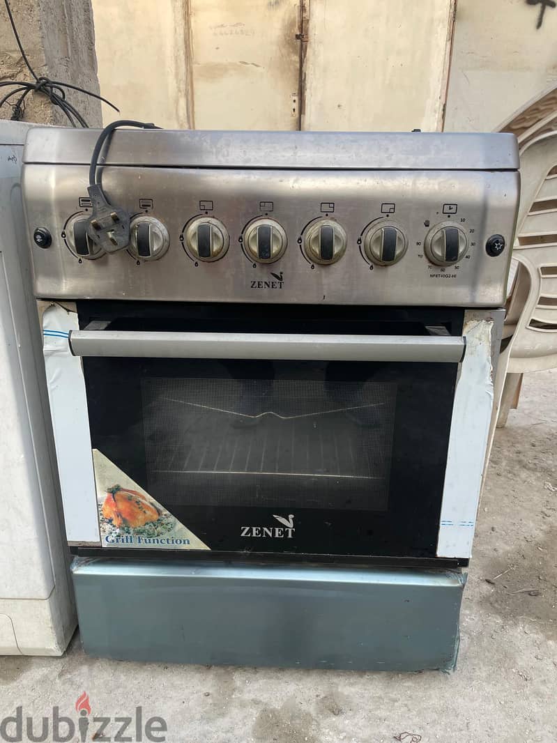 This is a ZENET 4-burner gas cooker with an integrated oven and grill 1