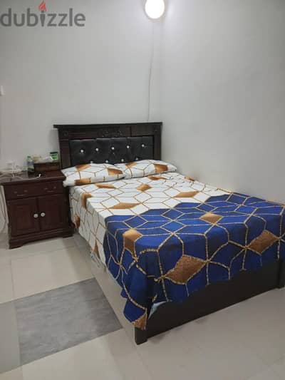 Bed with mattress and cabinet
