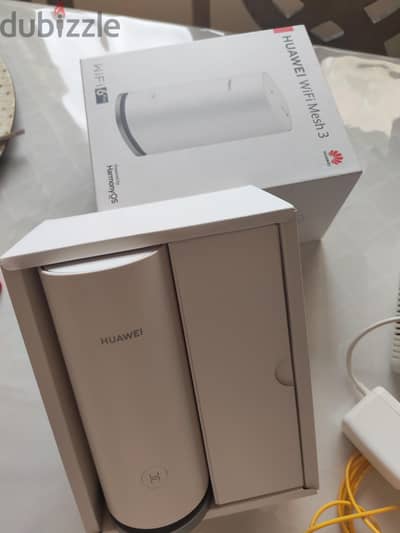 Threei routers one with box