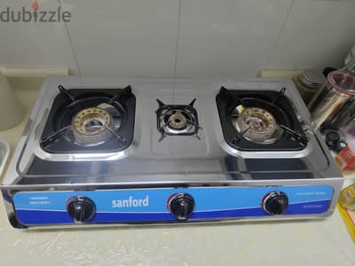 Cooking stove ( 3 burner) with medium sized bahrain gas cylinder.