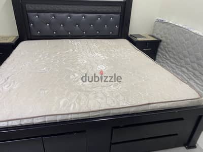 King size bed with side table without mattress