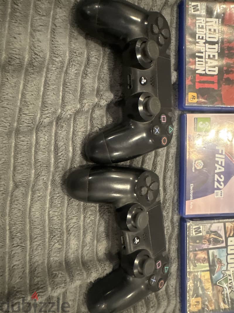 PS4 500GB , with 2 controllers and 3 games. Price 50bd negotiable 1