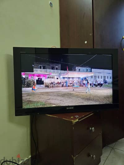 sony tv, dvd player and guitar