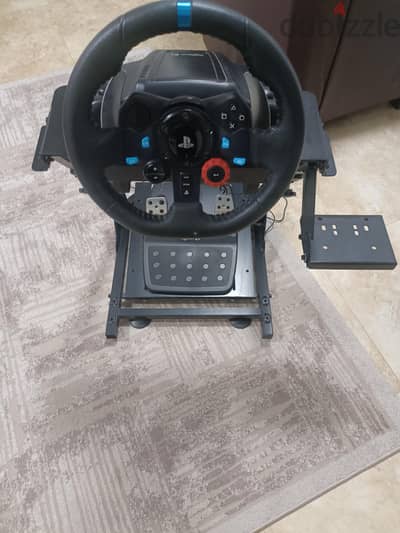 Logitech G29 steering wheel and stand.