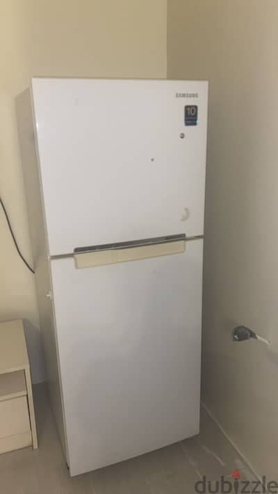 White medium size Samsung refrigerator
