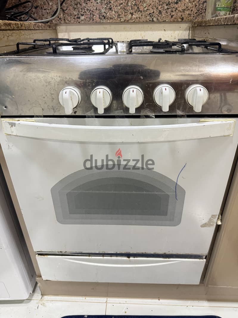 Cooking range, wardrobe, dining table for sale 2