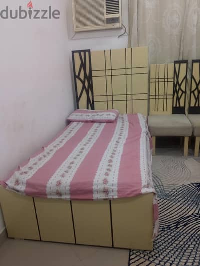 Two beds and two chairs